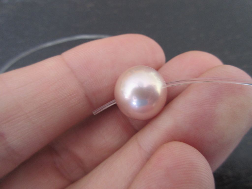 Perle auffädeln